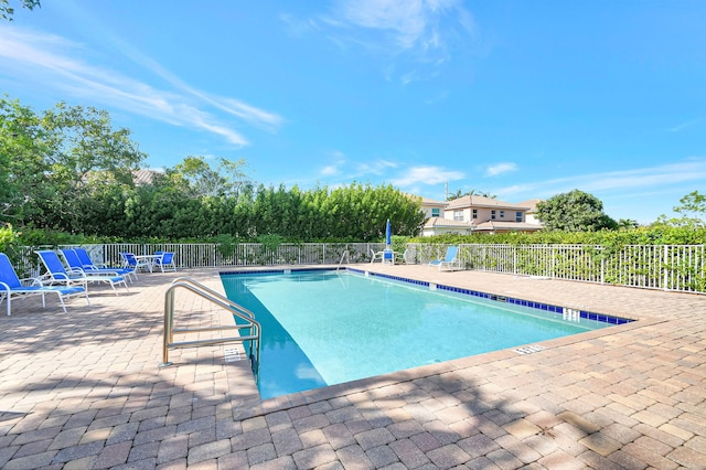 view of swimming pool featuring a patio