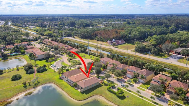 birds eye view of property featuring a water view