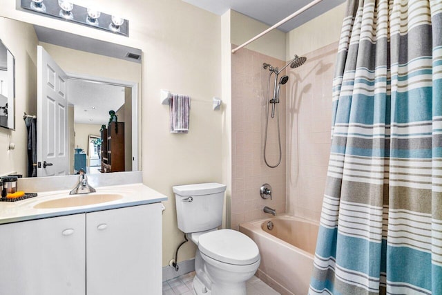 full bathroom with tile patterned floors, vanity, toilet, and shower / tub combo