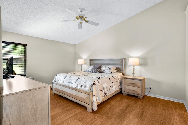 15321 Lake Wildflower Rd, Delray Beach, FL 33484 - bedroom with lofted ceiling, light wood-style floors, baseboards, a textured ceiling, and ceiling fan