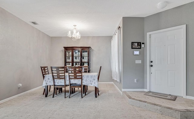 dining area featuring a chandelier