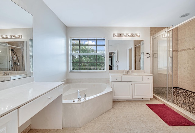 bathroom featuring tile patterned floors, vanity, and independent shower and bath