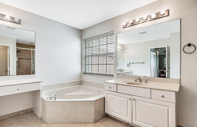 bathroom with shower with separate bathtub, vanity, and tile patterned floors