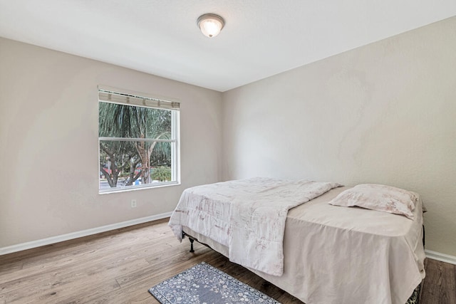 bedroom with hardwood / wood-style floors