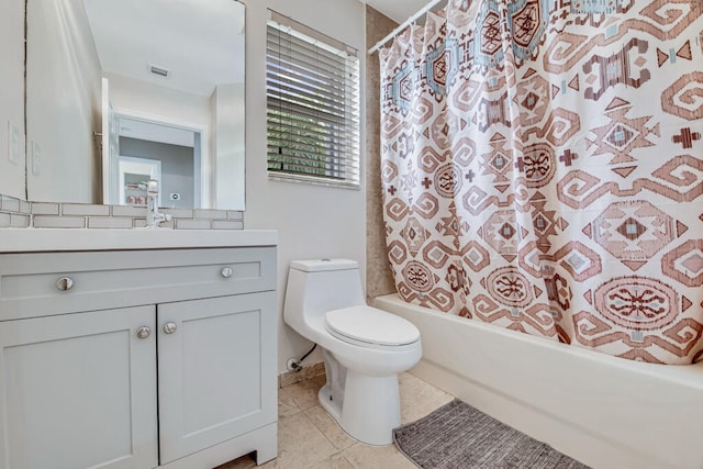 full bathroom featuring tile patterned floors, vanity, toilet, and shower / bath combination with curtain