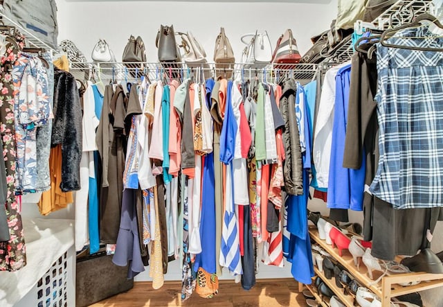 spacious closet featuring hardwood / wood-style floors