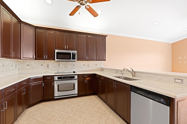 kitchen with sink, stainless steel appliances, backsplash, kitchen peninsula, and crown molding