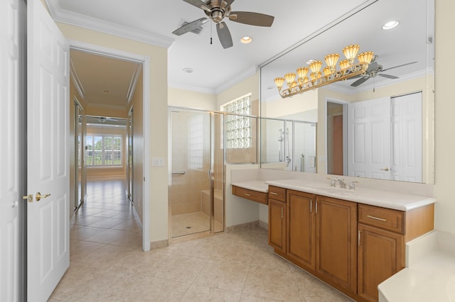 bathroom featuring walk in shower, vanity, ceiling fan, and crown molding