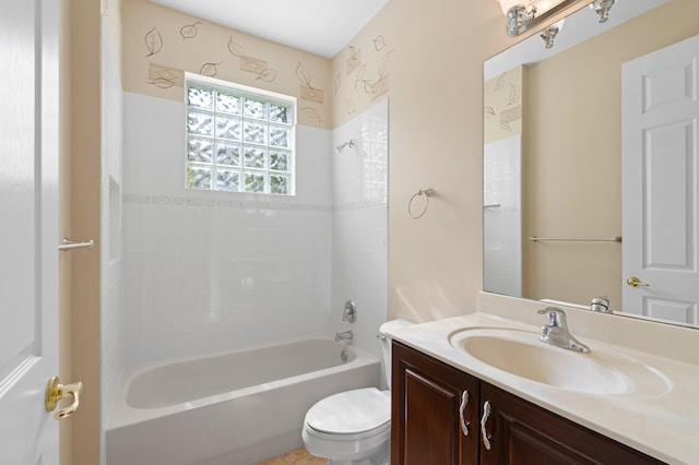 full bathroom with vanity, toilet, and tiled shower / bath