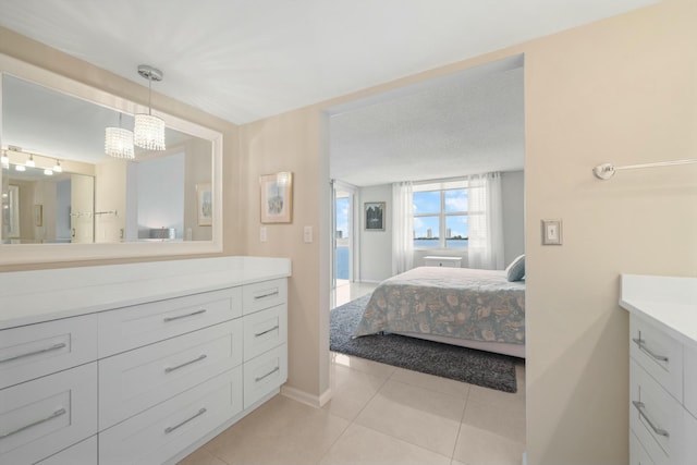 bathroom with tile patterned flooring and vanity