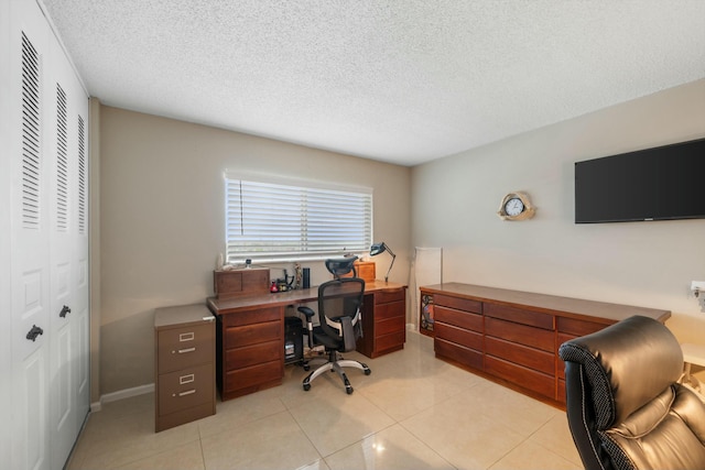 office featuring light tile patterned floors and a textured ceiling