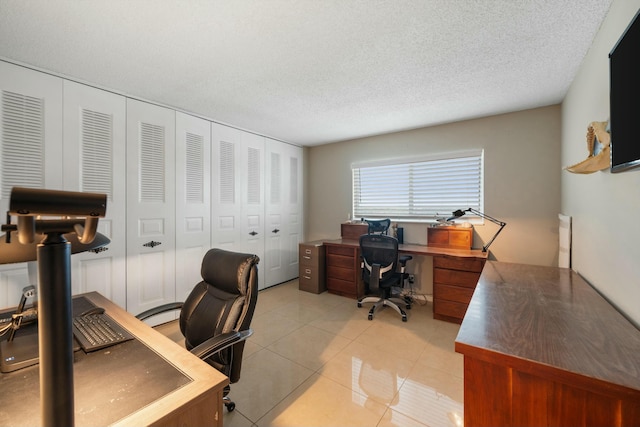 tiled office featuring a textured ceiling