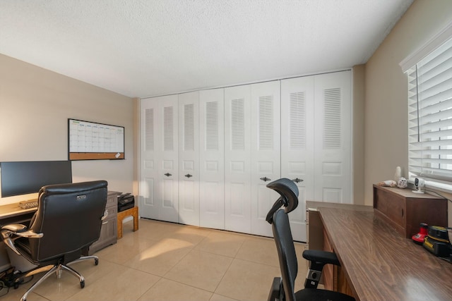 office space featuring light tile patterned floors and a textured ceiling