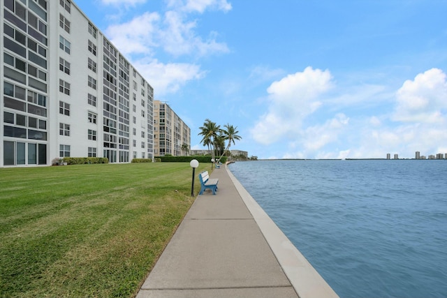 exterior space featuring a water view and a yard