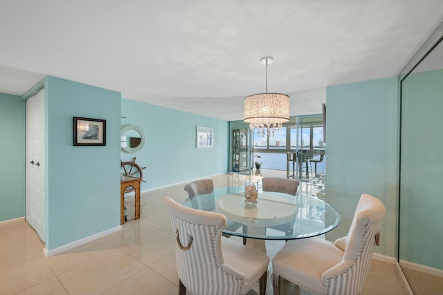 dining room with a notable chandelier and light tile patterned floors