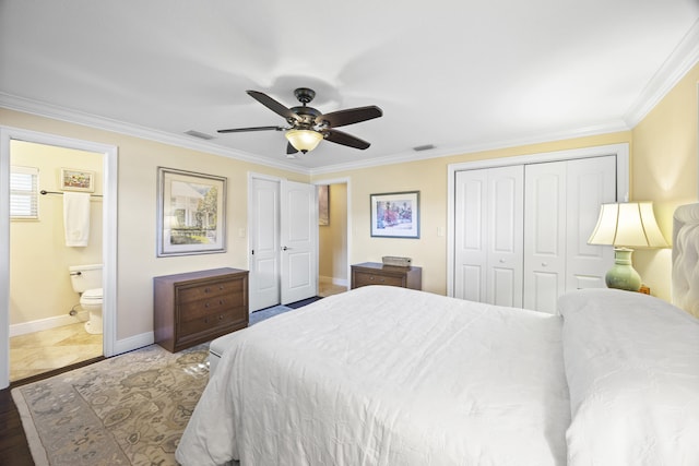 bedroom featuring ceiling fan, a closet, ensuite bathroom, and ornamental molding