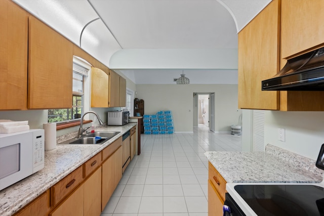 kitchen with stove, light tile patterned floors, stainless steel dishwasher, and sink