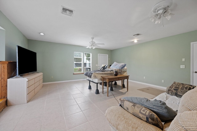 tiled living room with ceiling fan