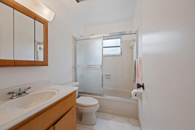 full bathroom featuring tile patterned flooring, vanity, combined bath / shower with glass door, and toilet