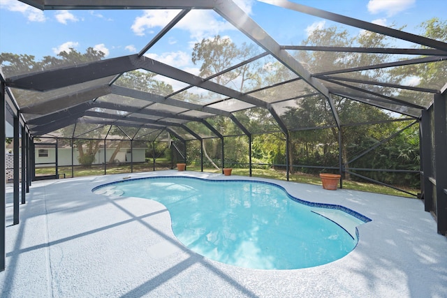 view of pool with a lanai and a patio