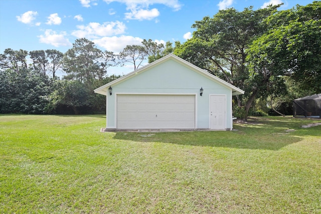 garage featuring a yard