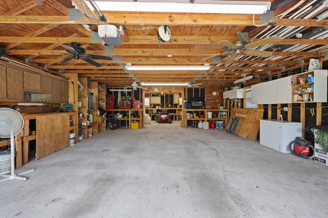 garage with a workshop area and fridge