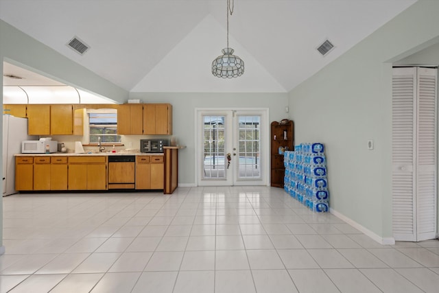 kitchen featuring french doors, stainless steel dishwasher, hanging light fixtures, and light tile patterned flooring