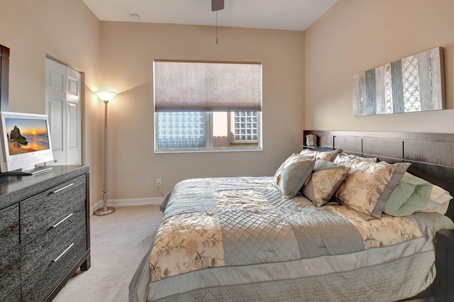 bedroom featuring ceiling fan and light colored carpet