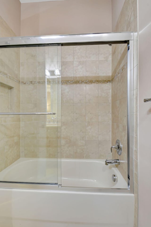 bathroom featuring enclosed tub / shower combo