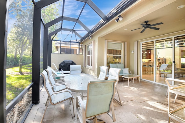 sunroom / solarium with ceiling fan