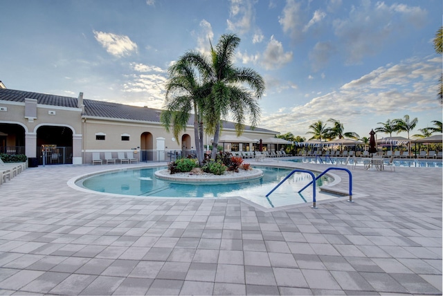 view of swimming pool with a patio area