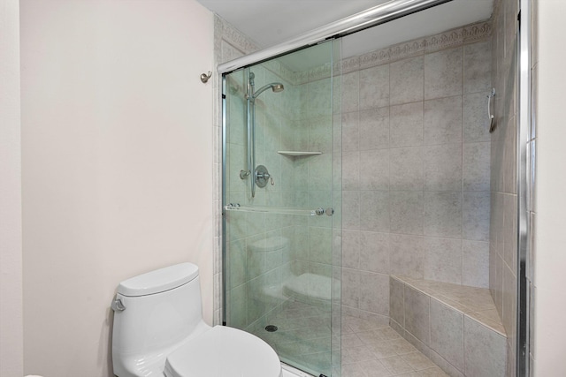 bathroom with toilet and walk in shower