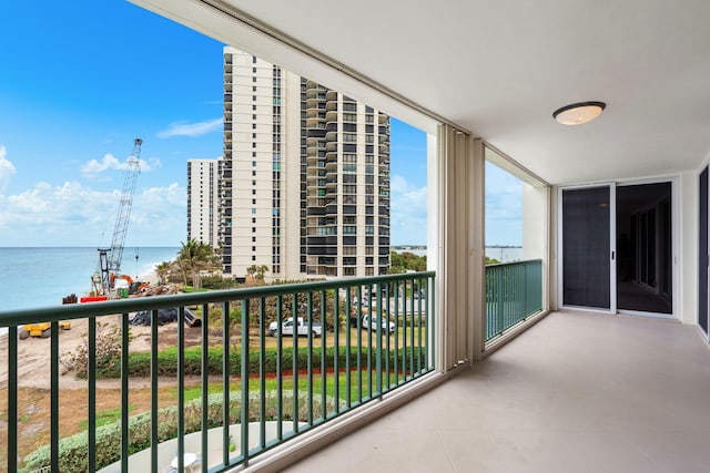 balcony featuring a water view