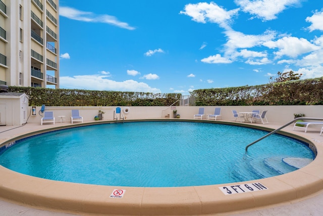 view of pool featuring a patio area