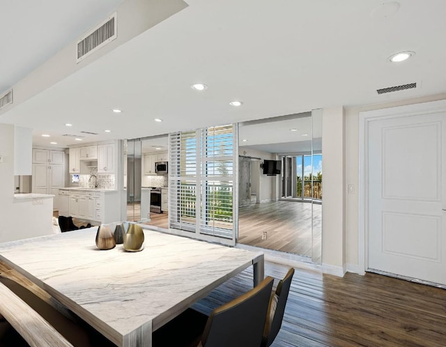 dining room featuring dark hardwood / wood-style floors