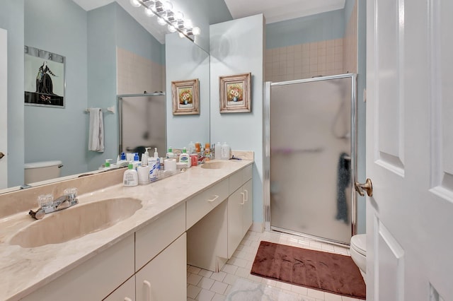 bathroom with tile patterned flooring, vanity, toilet, and a shower with door