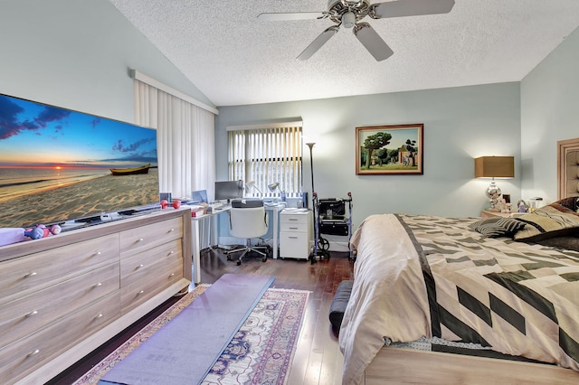 bedroom featuring ceiling fan, dark wood-type flooring, and a textured ceiling