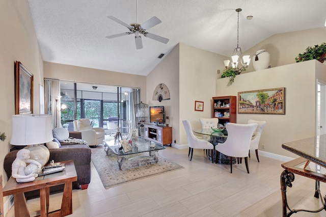 living room featuring a textured ceiling, high vaulted ceiling, and ceiling fan with notable chandelier