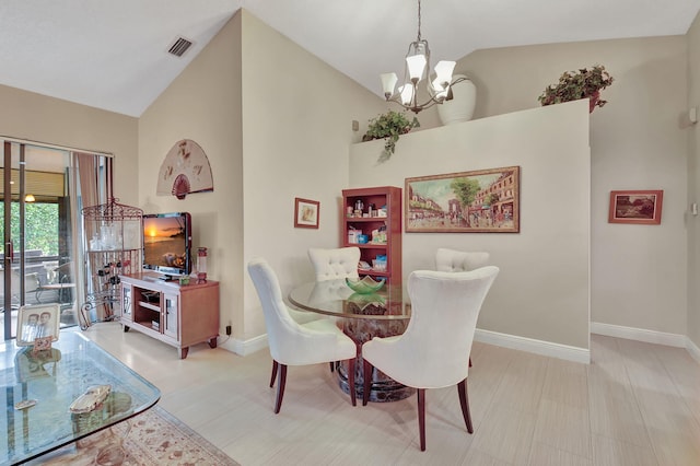 dining room featuring lofted ceiling and an inviting chandelier