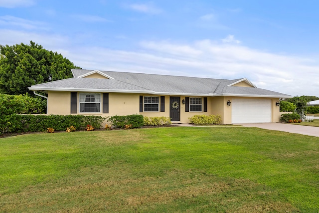 ranch-style home with a front yard and a garage