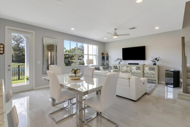 tiled dining room with ceiling fan