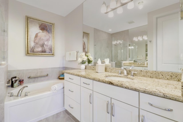 bathroom featuring vanity and shower with separate bathtub