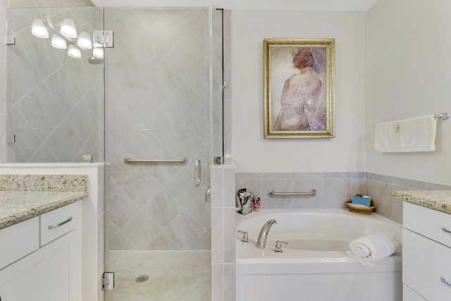 bathroom with shower with separate bathtub and vanity