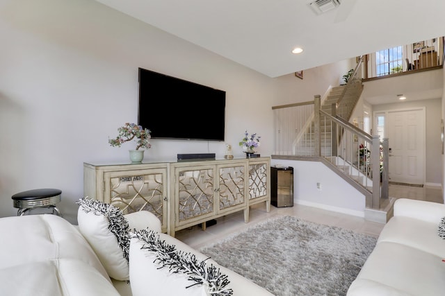 living room with light tile patterned flooring