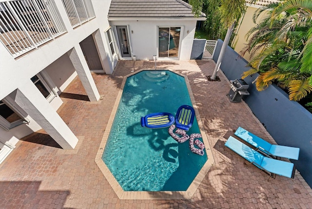 view of swimming pool with a patio