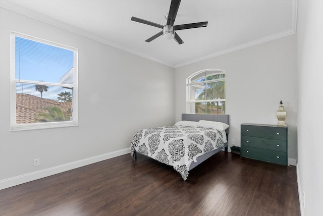 bedroom with ceiling fan, ornamental molding, and dark wood-type flooring