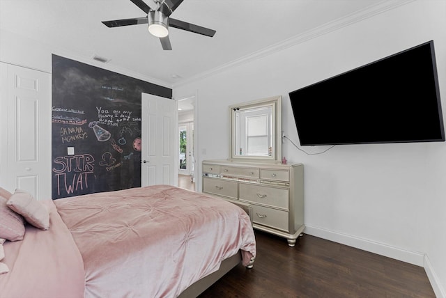 bedroom featuring dark hardwood / wood-style flooring, ceiling fan, and ornamental molding