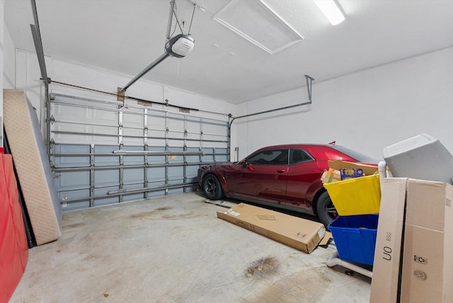 garage featuring a garage door opener