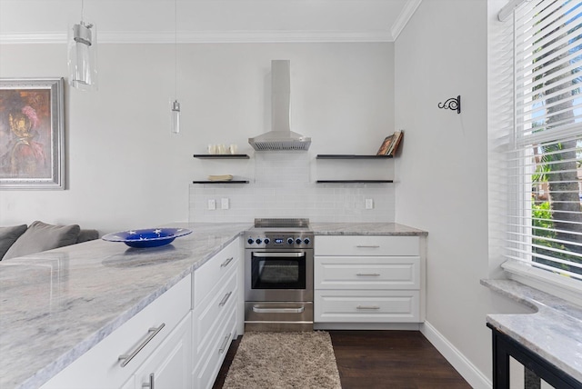 kitchen featuring pendant lighting, island range hood, white cabinetry, and stainless steel range oven