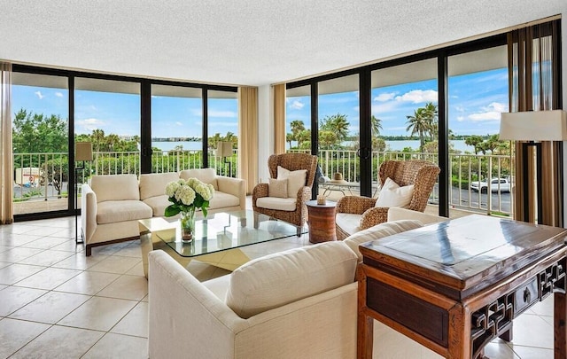 living room featuring floor to ceiling windows, light tile patterned floors, and a textured ceiling